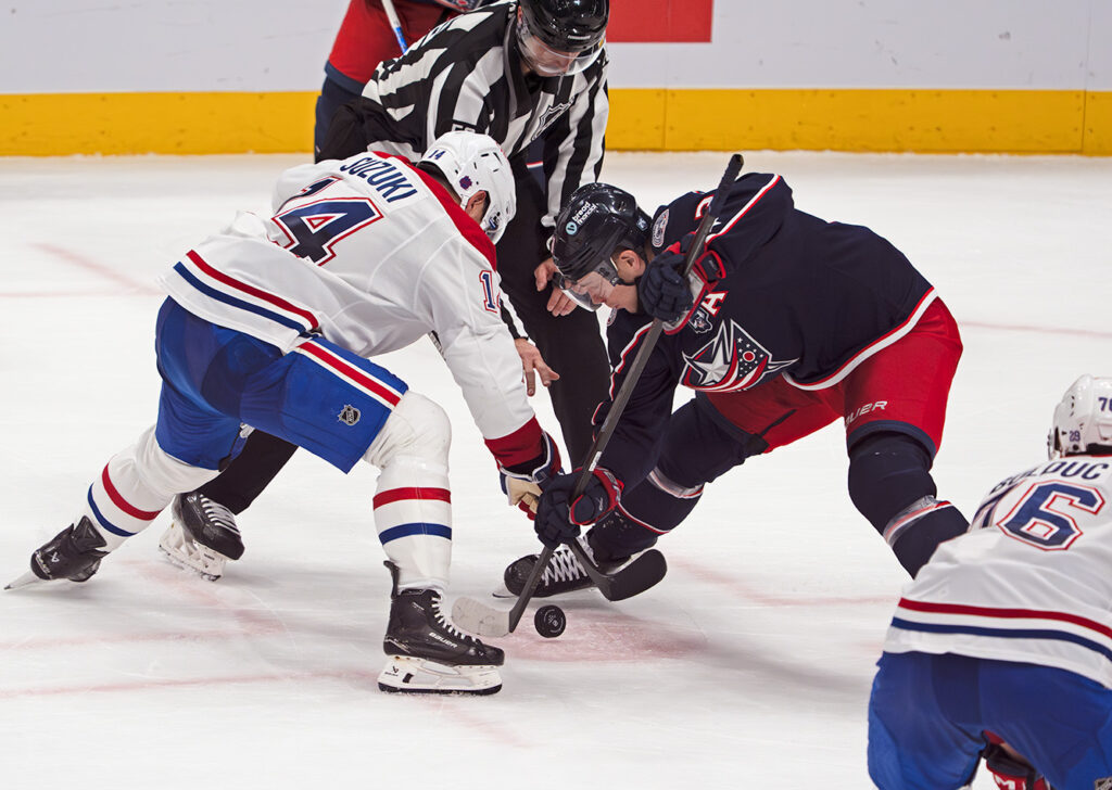 CBJ Charlie Coyle faces off