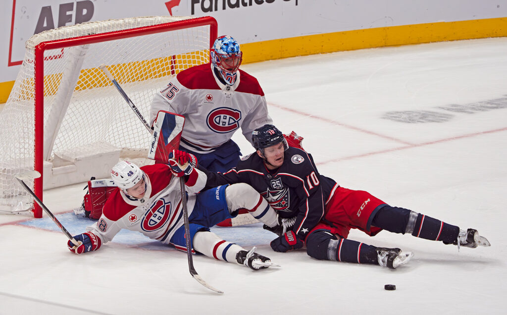 CBJ Dmitri Voronkov on ice in front of crease