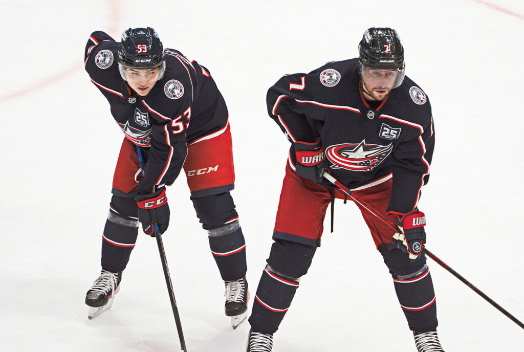 CBJ Luca Pinelli and Brendan Smith at face off circle