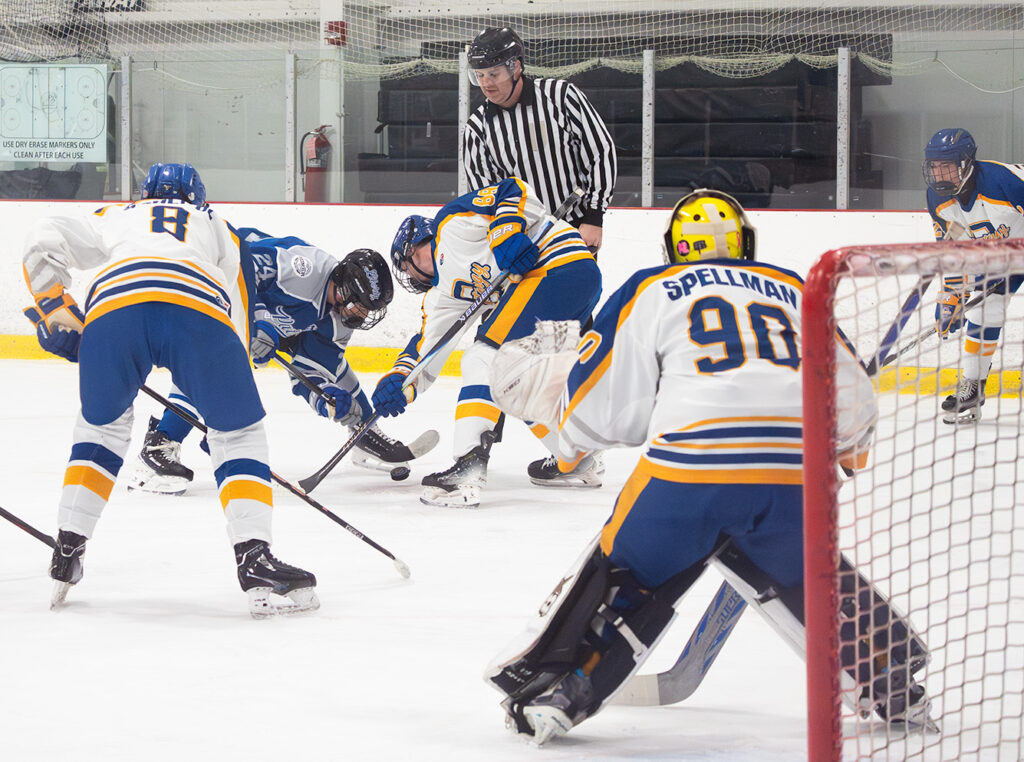 Face off to right of Olentangy goalie Zach Spellman