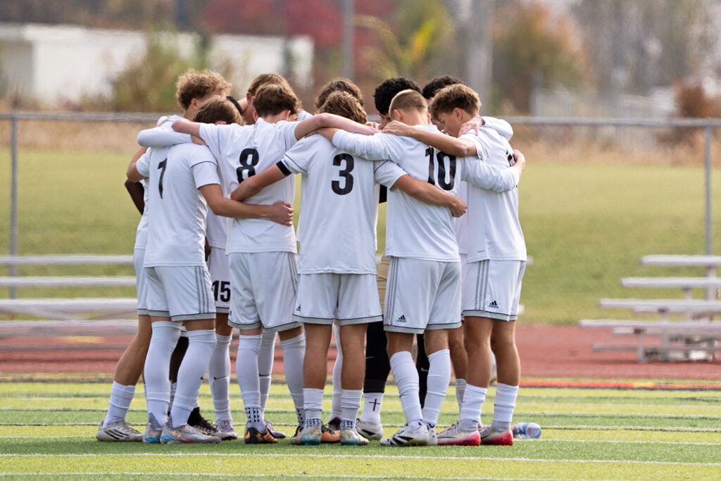 Westerville Central soccer starters huddle