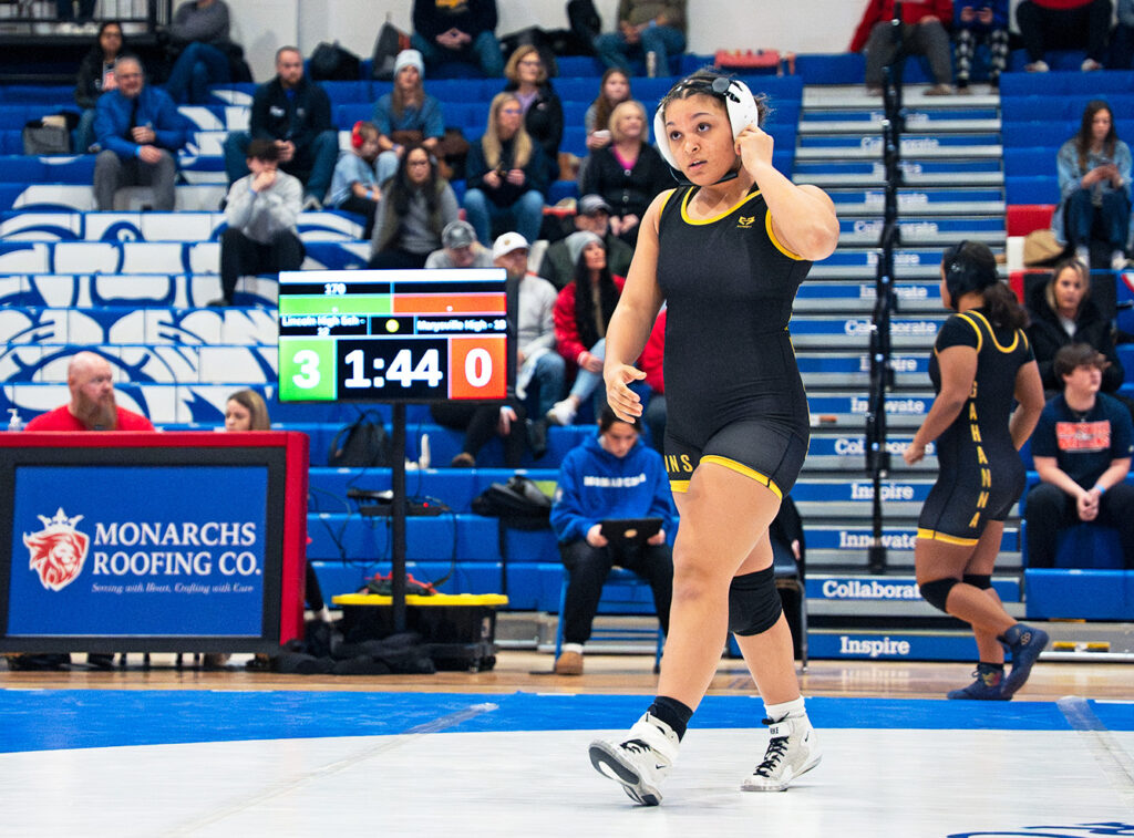 Gahanna's KyLee Tibbs walks across mat