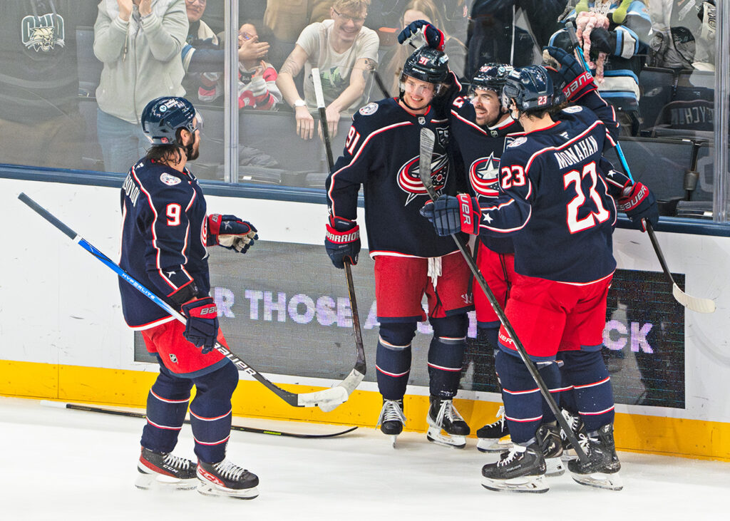 CBJ Connor Garland celebrates with team