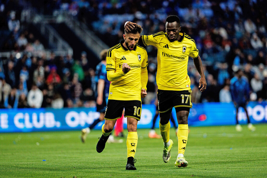 Crew's Diego Rossi and Sekou Bangoura celebrate goal