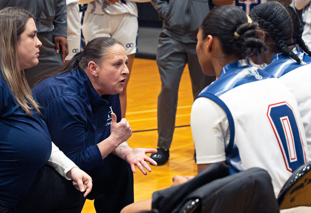 Hartley head coach Shannon Payer talks to team