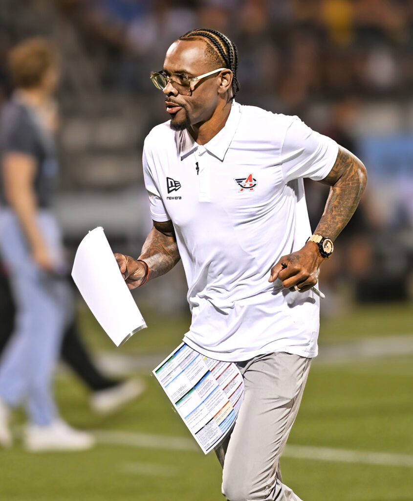 Aviators head coach Ted Ginn Jr heads to locker toom