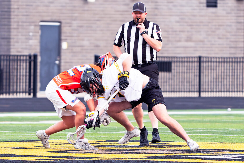 UA's Drew Fahrback and Orange's Ari Zavarella face off