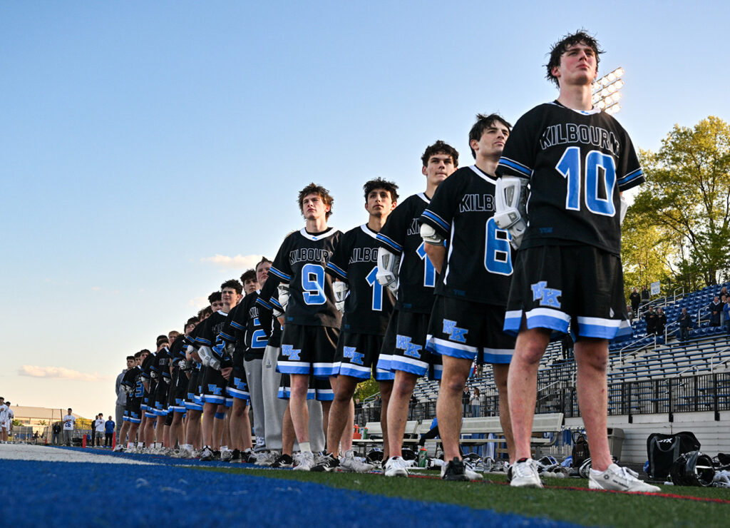 Kilbourne boys lacrosse lines up for national anthem