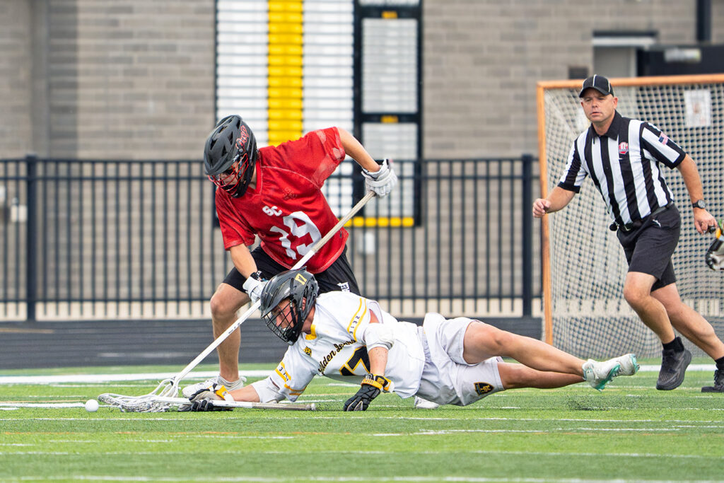 Upper Arlington's Luke Backes dives for ball