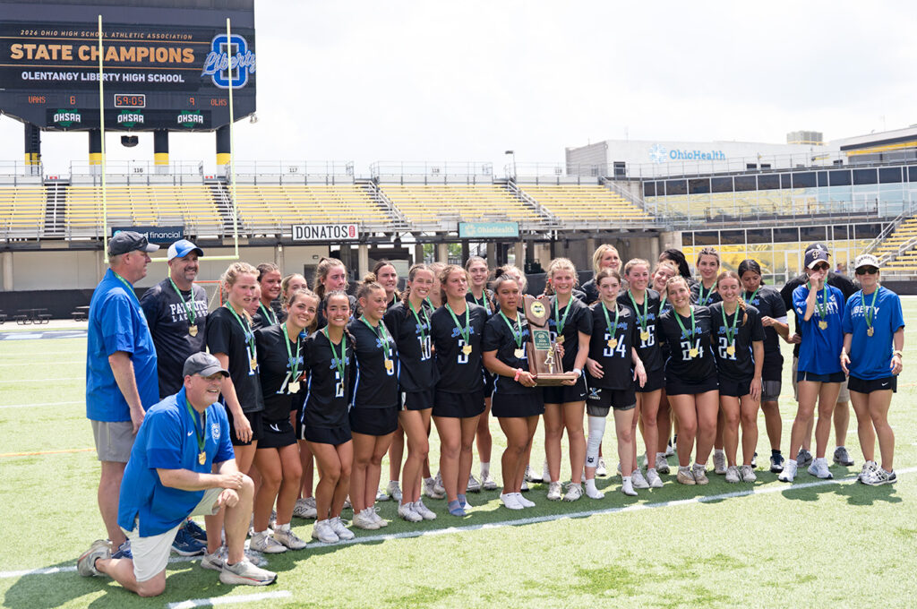 Liberty's team photo with championship trophy