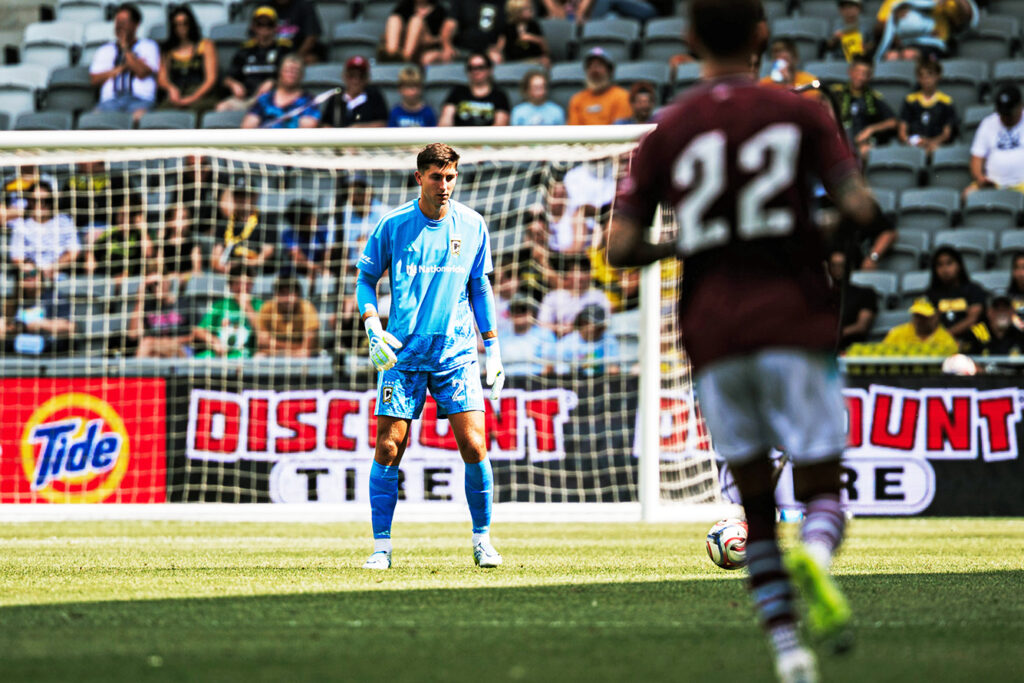 Crew goalkeeper Patrick Schulte eyes play