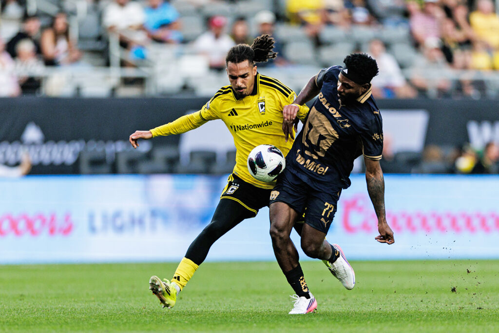 Crew's Mohamed Farsi battles for ball