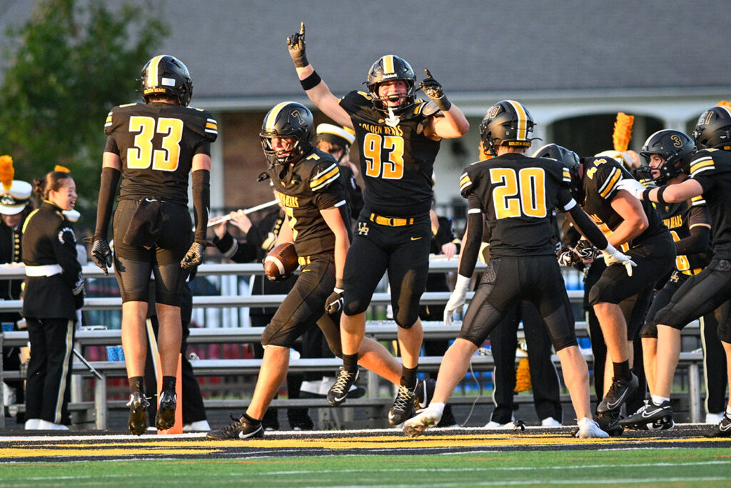 Upper Arlington's Tyler Witten scores after a fumble