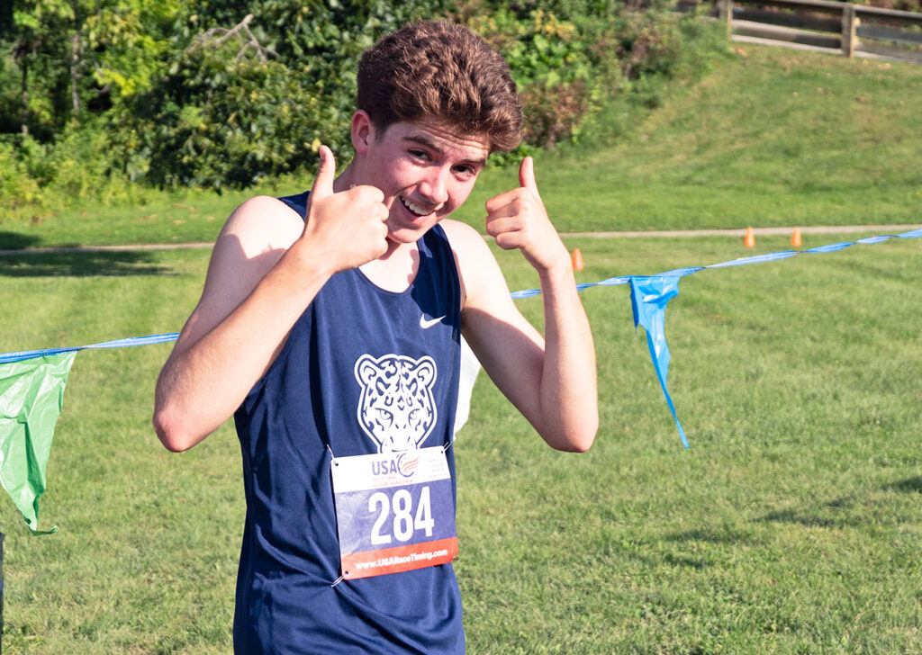 Wellington cross country's Ben Austin thumbs up after win