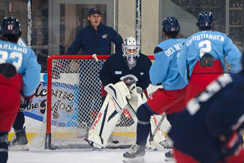 CBJ training camp action around net