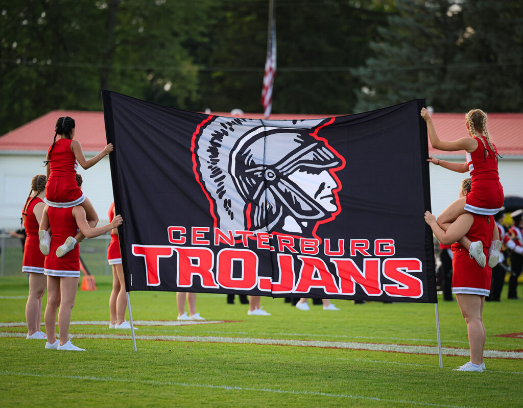 Centerburg football cheerleaders hold banner