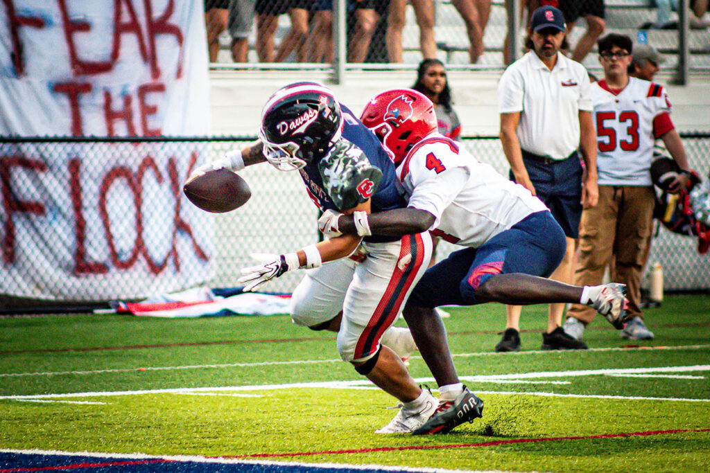 Grove City's Blaike Jackson tackled by Thomas Worthington's Kodwo Sey