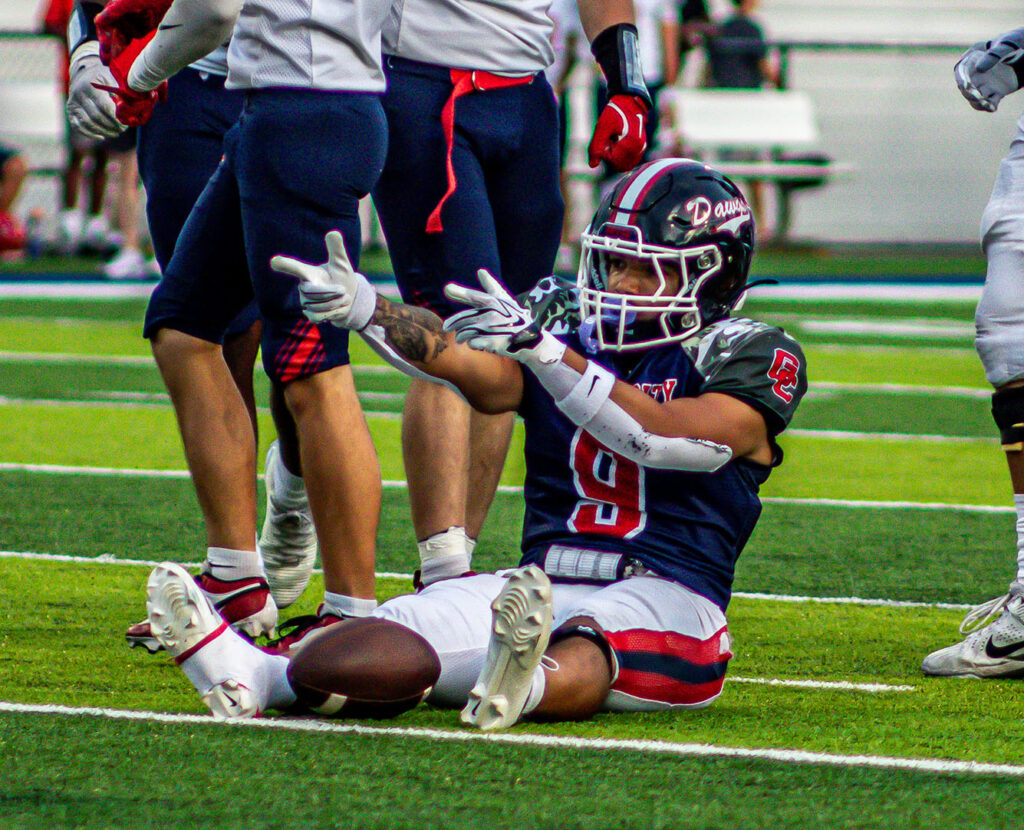 Grove City's Blaike Jackson signals first down