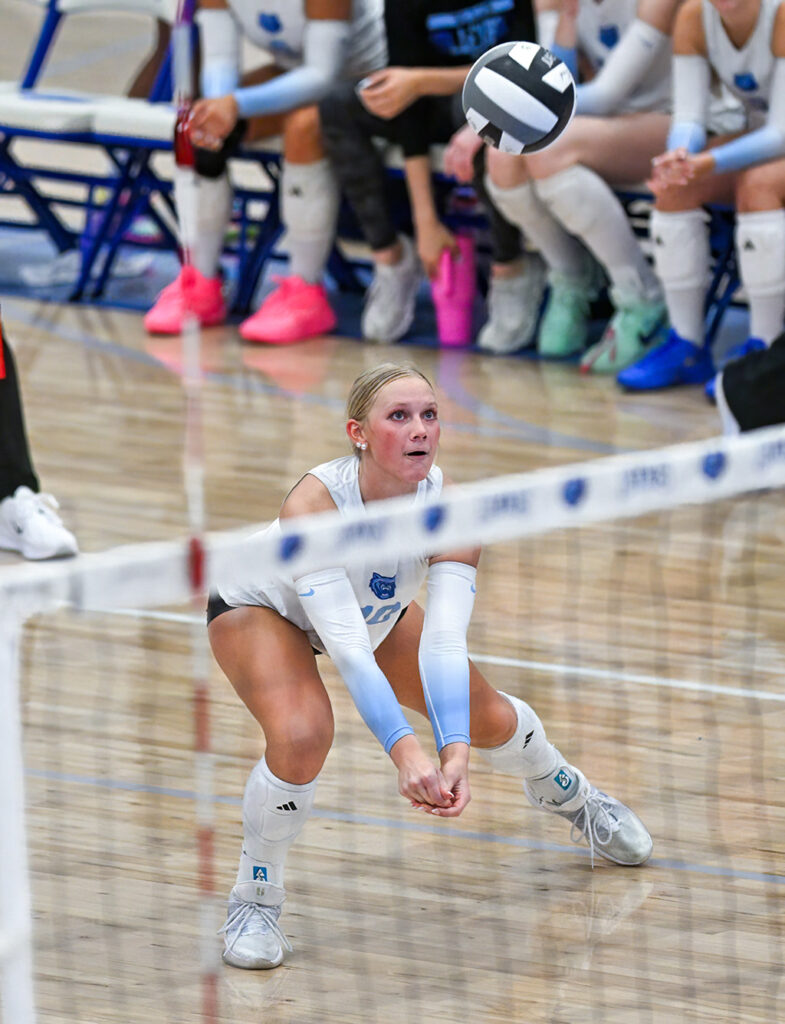 Berlin's Jillian Rode digs serve