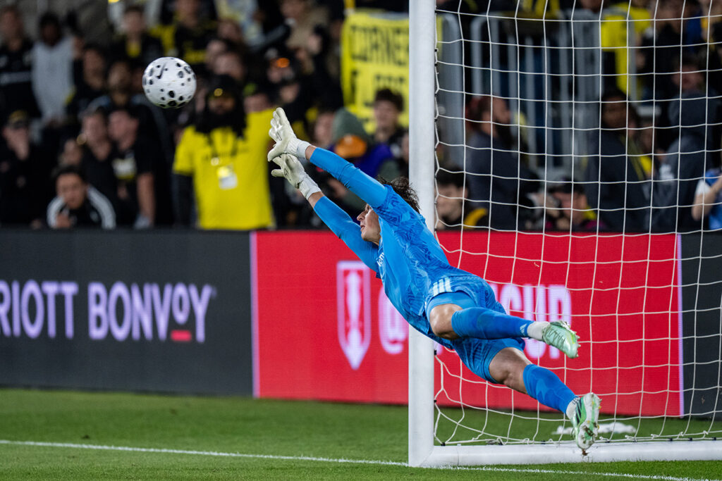 Crew's Nicholas Hagen dives for save