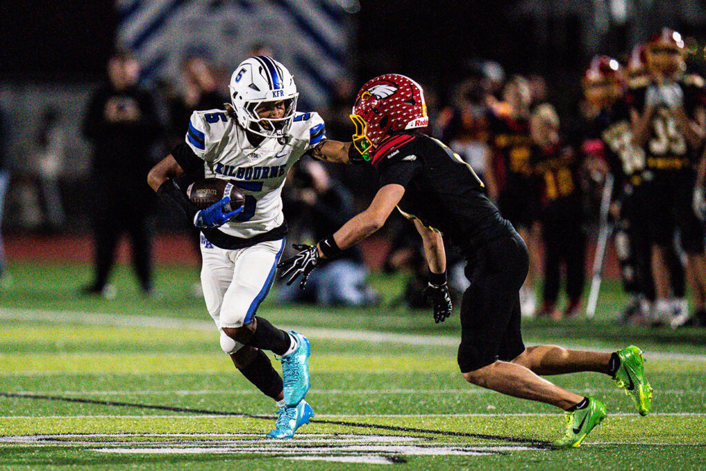 Kilbourne's Shawn Rice runs after catch