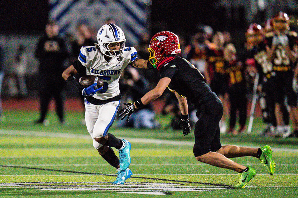Kilbourne's Shawn Rice runs after catch