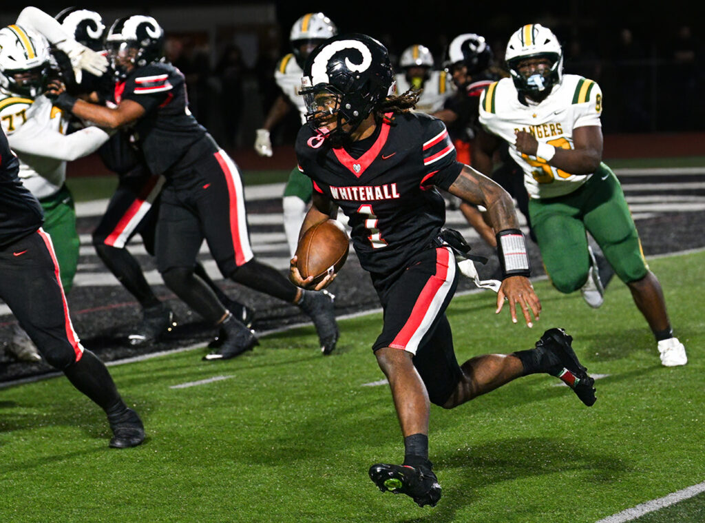 Whitehall's Malachi Jackson runs